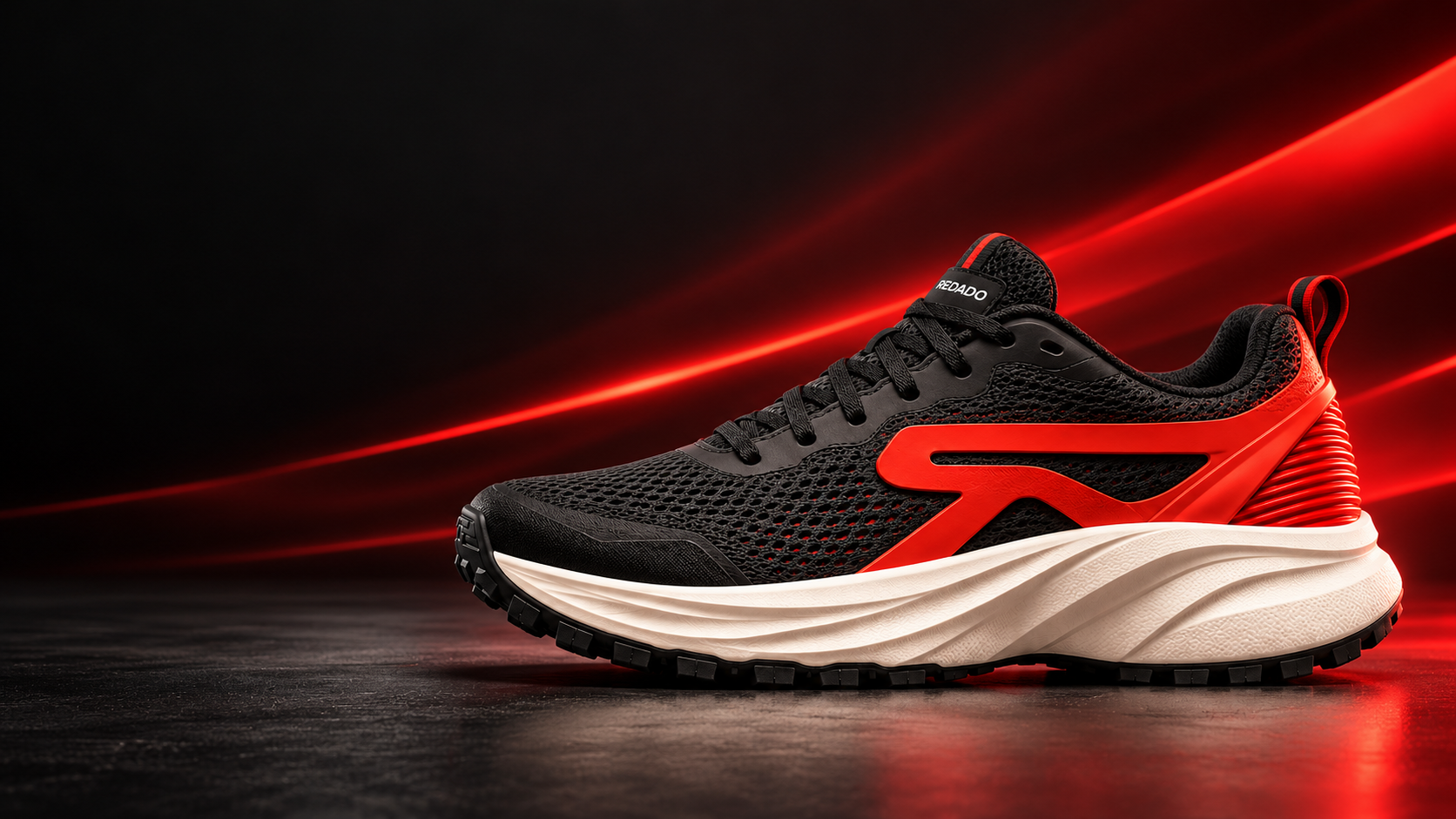 Illustrative black and red REDADO shoe in a dark studio campaign.